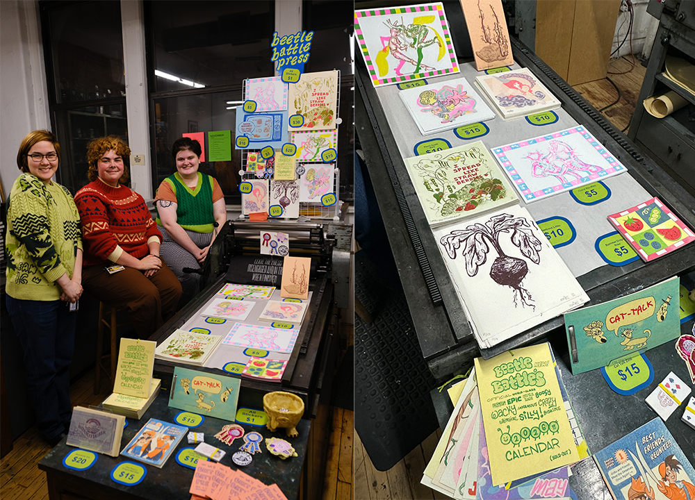 Beetle Battle Press posing at their art vending table at the 2025 Center For Book Arts Winter Market